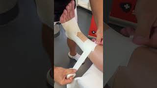 Comfortable taping of the ankle with Spophy Athletic Tape and layer of foam [upl. by Naivat]