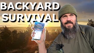 Backyard camping with space blanket lean to shelter and self feeding fire [upl. by Ashbaugh]