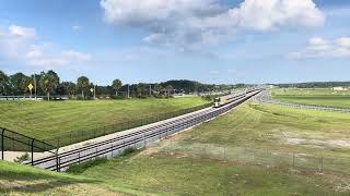 Brightline Bright Orange heading into Orlando International Airport [upl. by Lewan]