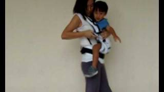 Manduca Baby Carrier Instructions  Switching from Side Carry to Front Carry Position [upl. by Lattonia]