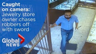 Jewelry store owner chases robbery suspects off with sword [upl. by Llenal]