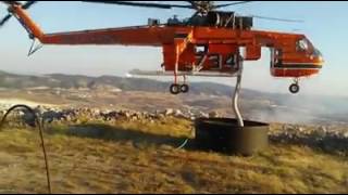 Sikorsky S64 Skycrane pumps water from a water tank 15 meters away Greece [upl. by Akcired]