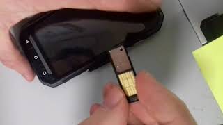 How to Insert SIM card in CATERPILLAR S30 [upl. by Chally]