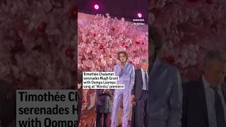 Timothée Chalamet serenades Hugh Grant with Oompa Loompa song at ‘Wonka’ premiere [upl. by Selassie292]