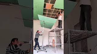 The process of installing plasterboard on the ceiling using a hoist [upl. by Pizor]