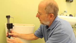 How to Install a Fluidmaster 400A Toilet Fill Valve  PlumbingSupplycom [upl. by Enomad644]