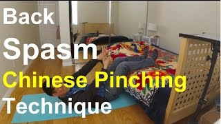 Back Spasm Chinese Pinching Technique How to Video [upl. by Darees]