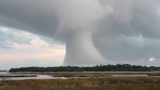 Microburst Waterspout Strange cloud formation baffles Oak Island North Carolina residents [upl. by Osnohpla]