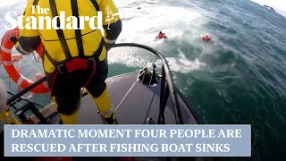 Dramatic moment four people are rescued after fishing boat sinks off Scotland’s west coast [upl. by Anyl]